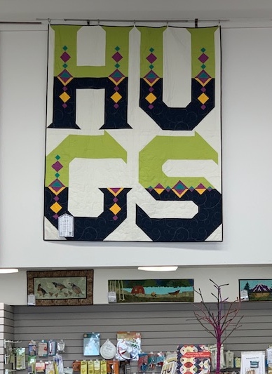 Hugs Quilt displayed at the Stitchin' Post in Sisters, Oregon